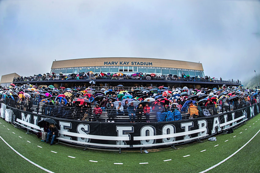 Friends and family members of Golden High School’s Class of 2022 huddled together beneath umbrellas as the school’s 148th commencement ceremony took play Friday, May 20, on Campbell Field at Marv Kay Stadium.